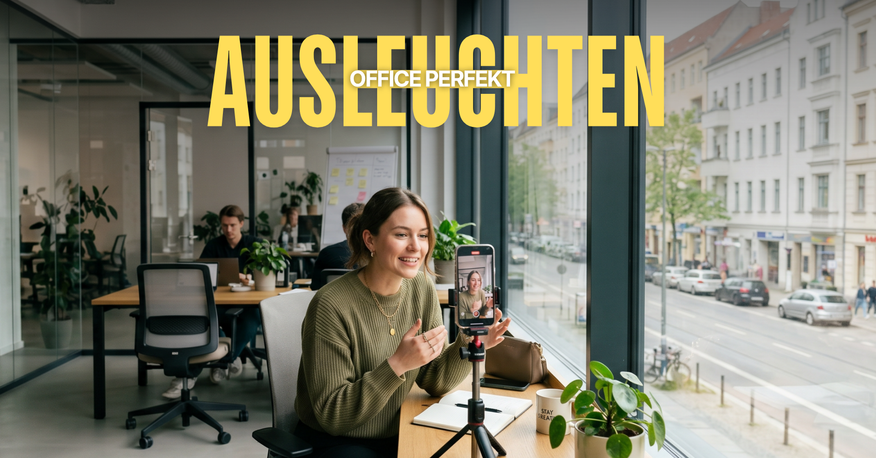 junge Frau sitzt am Tisch im perfekt ausgeleuchteten office und nimmt ein video auf
